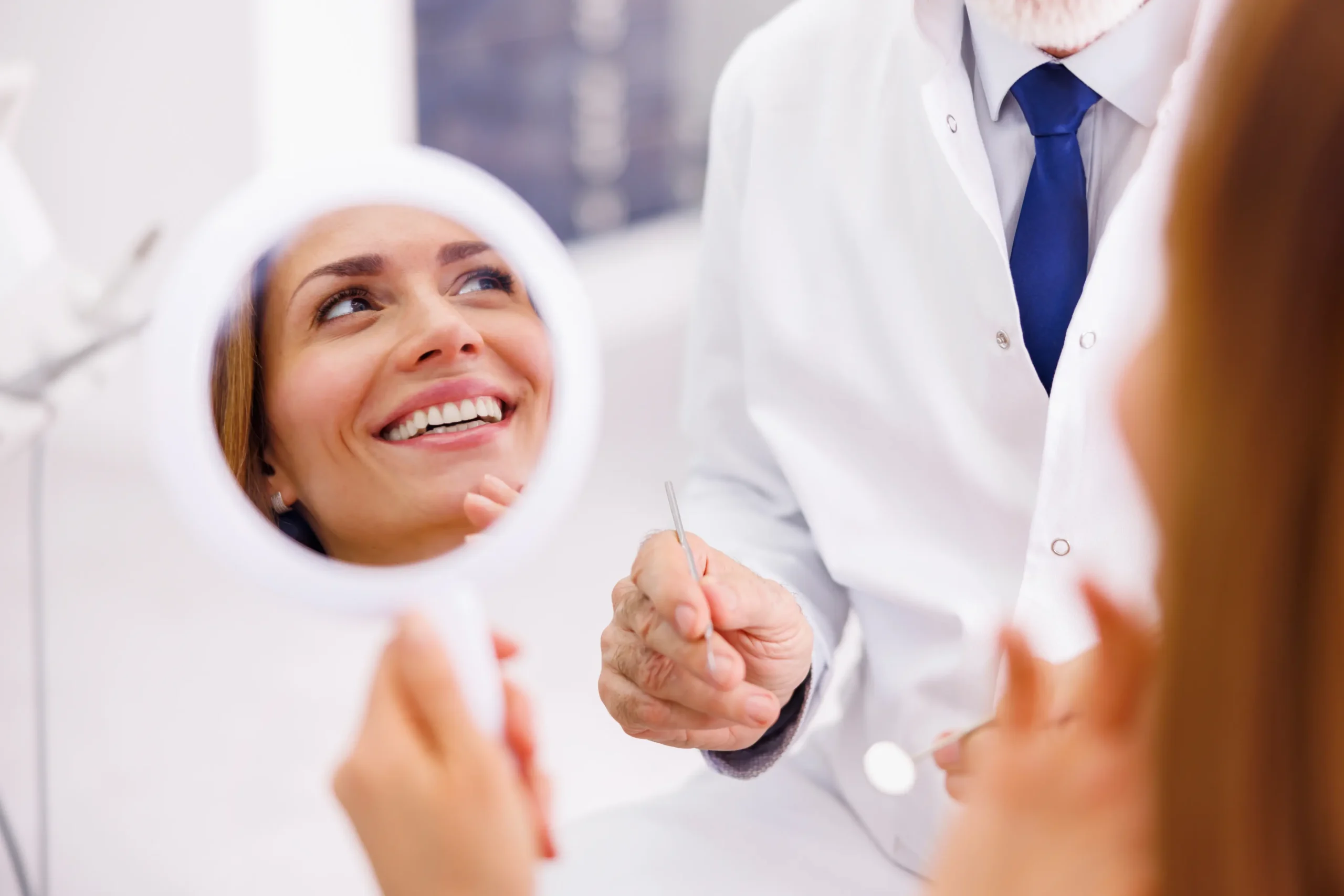 dentist and patient during the discussion for cosmetic restoration.