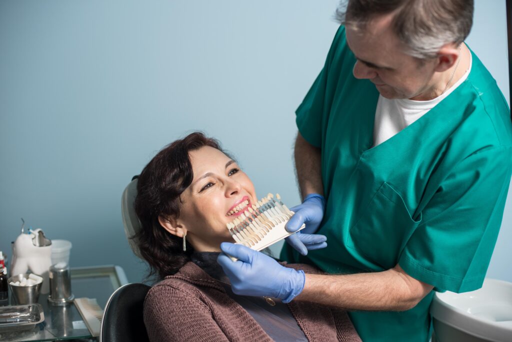dentist help her patient for her teeth restoration