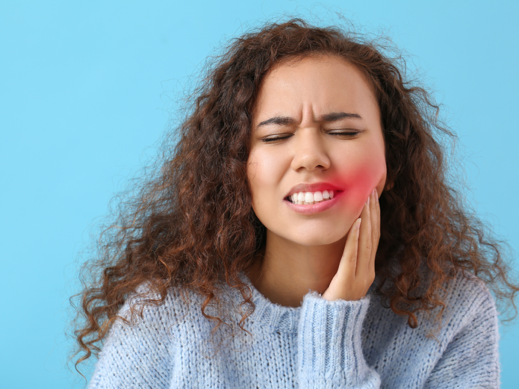 A patient is experiencing pain due to tooth sensitivity